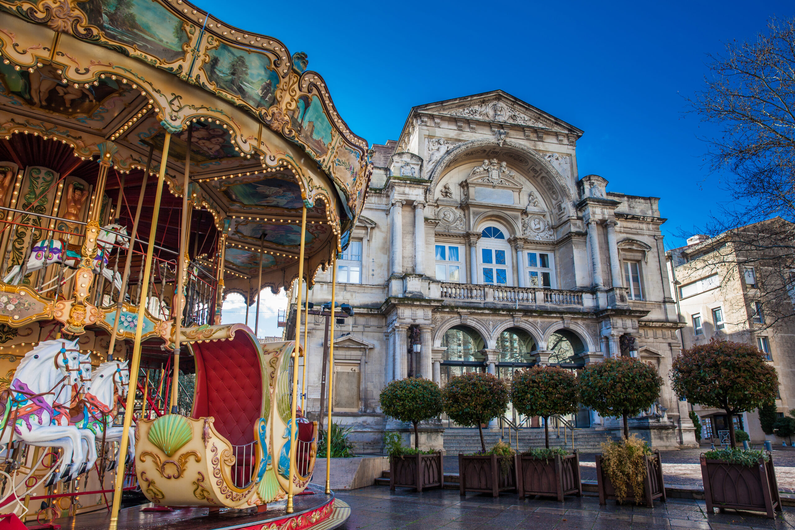 AVIGNON - MARCH, 2018: French old-fashioned style carousel with stairs at Place de l'Horloge in Avignon France
